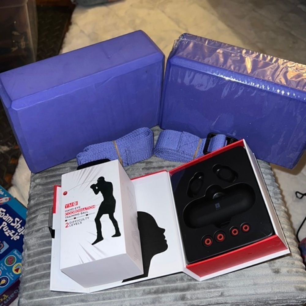 Workout ear buds , yoga squares, two belts and hand eye trading‎ ball for head.